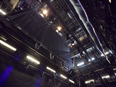 Looking up into the automation and lighting of the Milton Court Theatre